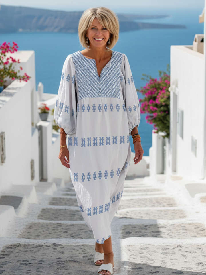 Evadne | Robe longue élégante et raffinée à manches longues, col en V et broderies délicates